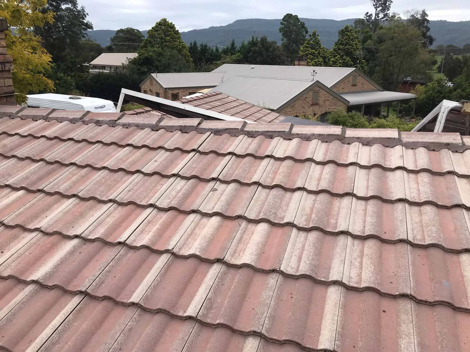 Ridge capping repointed on a tiled roof
