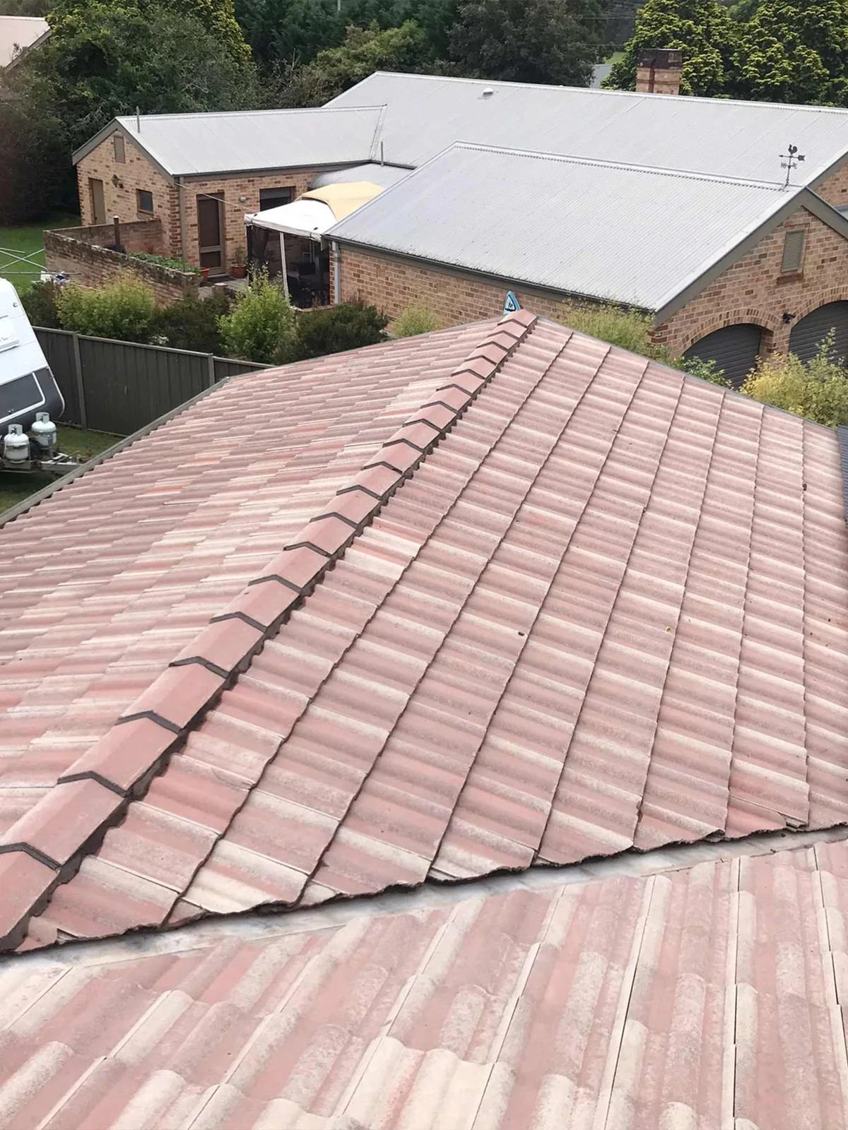 A tile roof after pressure cleaning, before recoating